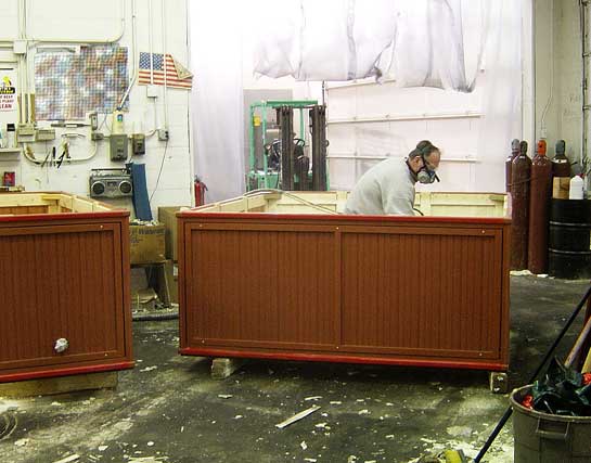 Cabinet insulation being applied